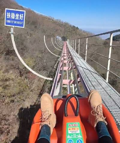 Glide down the signature slide at Qixing Mountain