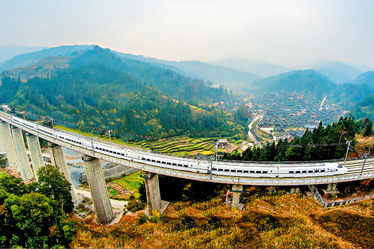 The Train is passing by a Miao Village